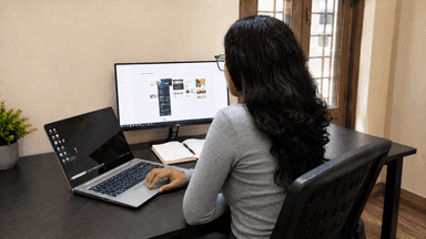 Jyoti working at her desk